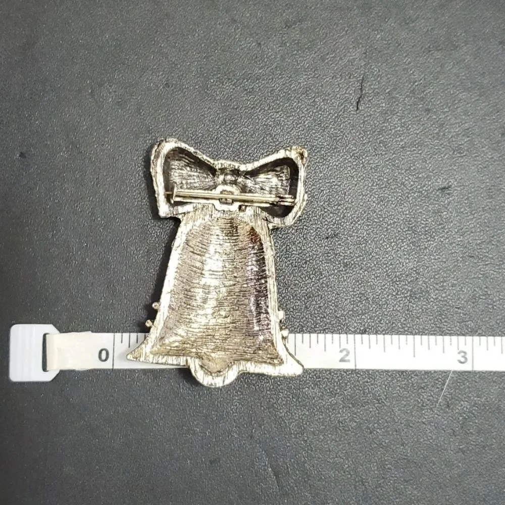 Vintage gold tone bell brooch